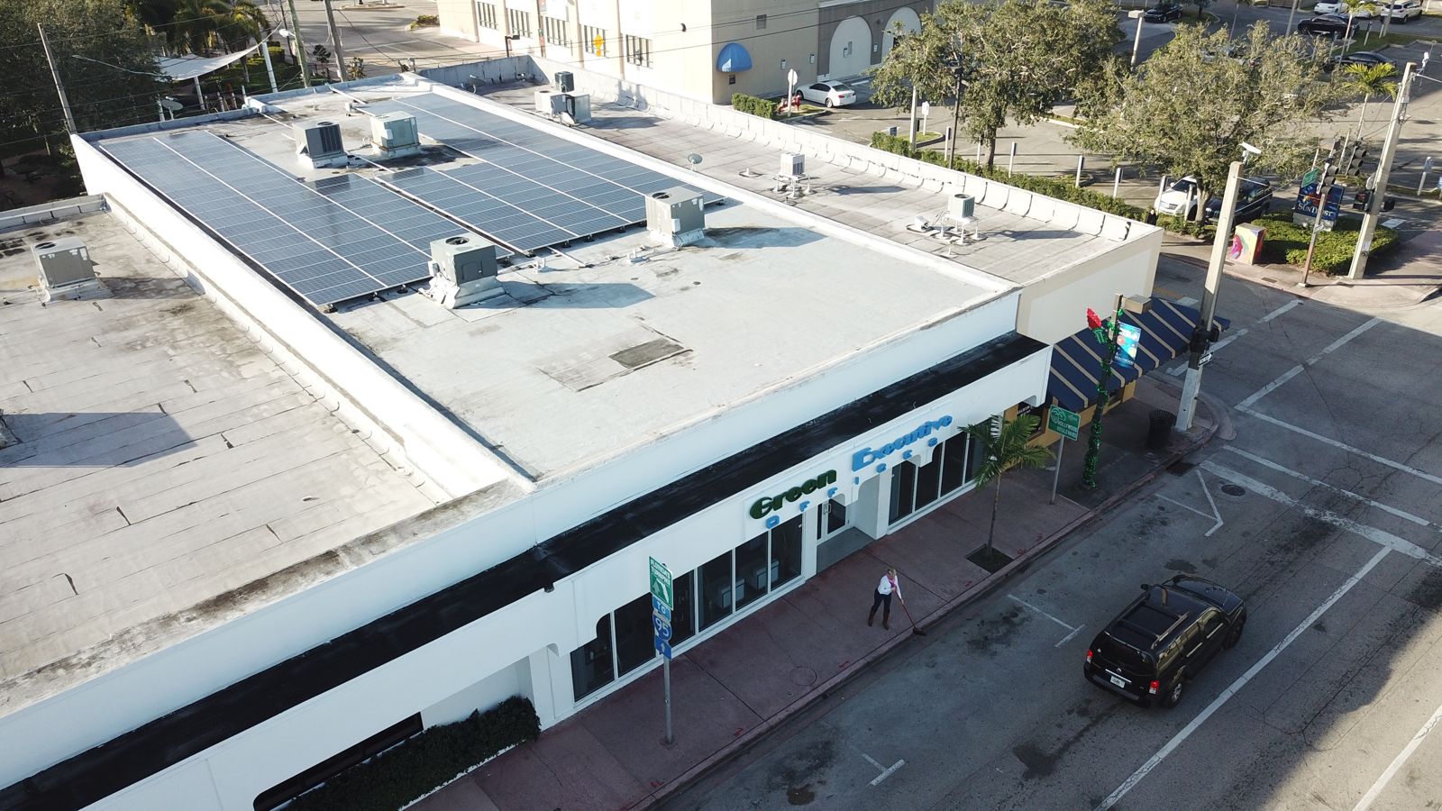 Aerial view of the building with solar panels on the roof